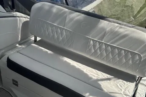 Slide: The Image of 2024 Crownline 270 CR boat interior with white cushioned seating. - 5