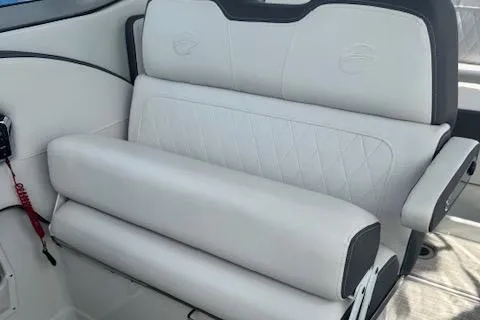 Slide: The Image of 2024 Crownline 270 CR boat interior seating with white upholstery and elegant design. - 9