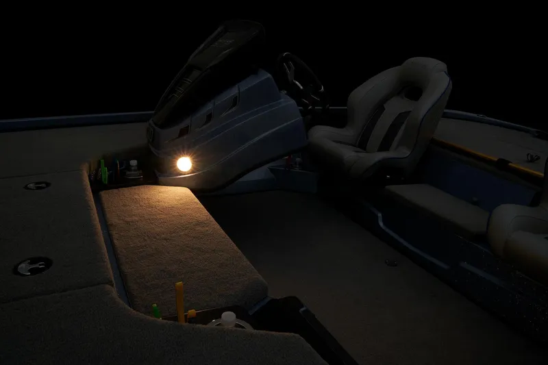 Slide: The Image of 2024 Nitro Z18 Pro boat interior with illuminated dashboard and seating. - 26