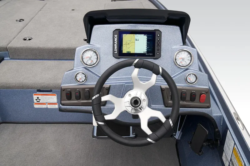 Slide: The Image of 2024 Nitro Z18 Pro boat dashboard with steering wheel and Lowrance fishfinder. - 28