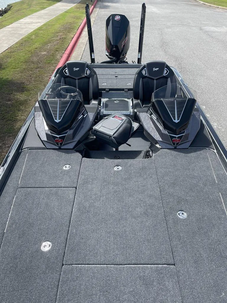 Slide: The Image of 2024 Ranger Z521R Ranger Cup Equipped boat interior with dual seats and storage compartments. - 2
