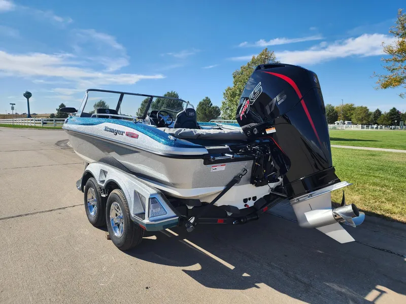 Slide: The Image of 2024 Ranger 1880MS boat on a trailer with an outboard motor. - 2