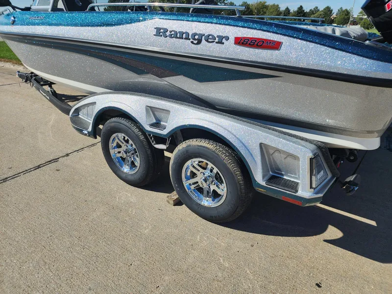 Slide: The Image of 2024 Ranger 1880MS boat on a dual-axle trailer, side view. - 4