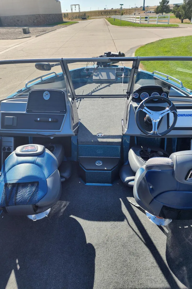 Slide: The Image of 2024 Ranger 1880MS boat interior with steering wheel and seating. - 5