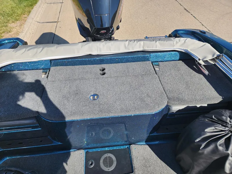 Slide: The Image of 2024 Ranger 1880MS boat interior with motor, storage compartments, and seating. - 6