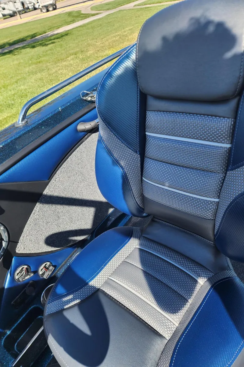 Slide: The Image of 2024 Ranger 1880MS boat seat with blue and gray upholstery. - 7