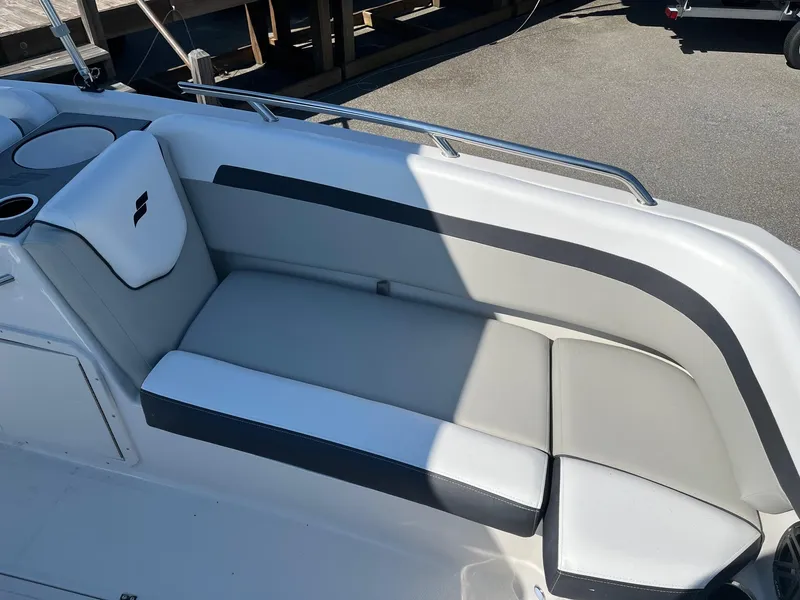 Slide: The Image of 2024 Starcraft SVX 191 boat interior seating with gray and white upholstery. - 5