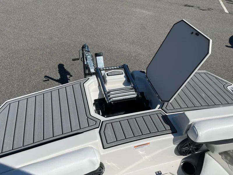 Slide: The Image of 2024 Starcraft SVX 191 boat with open storage compartment and ladder. - 6