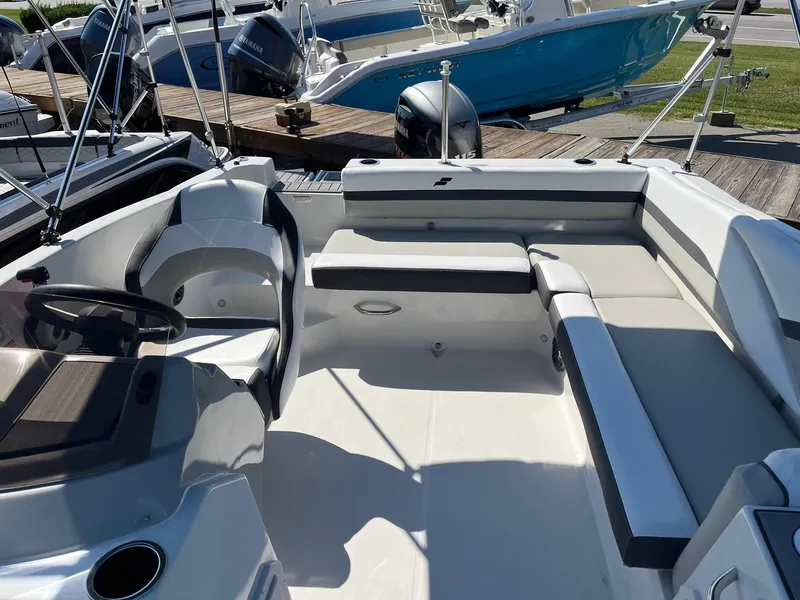 Slide: The Image of 2024 Starcraft SVX 191 boat interior with seating and steering wheel. - 11