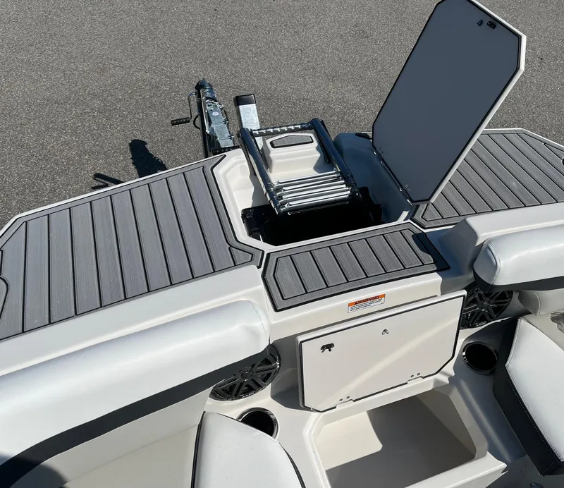 Slide: The Image of 2024 Starcraft SVX 191 boat with open storage compartment and ladder. - 7