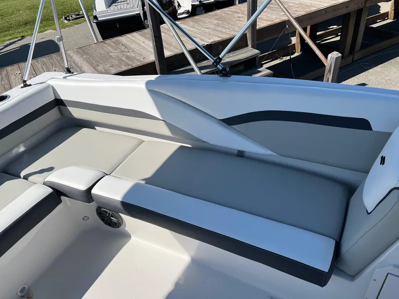 Slide: The Image of 2024 Starcraft SVX 191 boat interior with gray and white seating. - 8