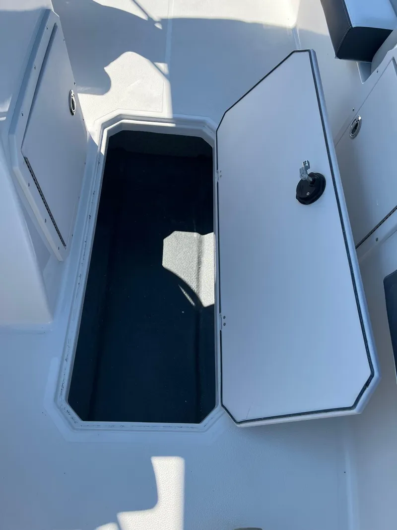 Slide: The Image of 2024 Starcraft SVX 191 boat storage compartment with open hatch. - 14