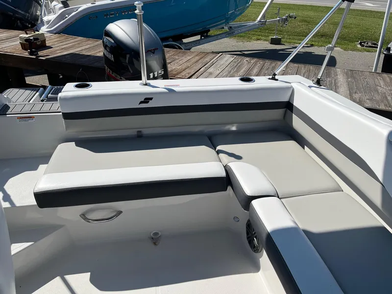 Slide: The Image of 2026 Starcraft SVX 191 boat interior with cushioned seating and outboard motor. - 9