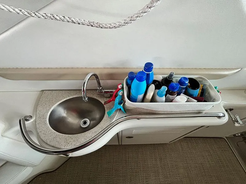 Slide: The Image of 2008 Sea Ray 38 Sundancer boat sink with toiletries and sunscreen. - 11