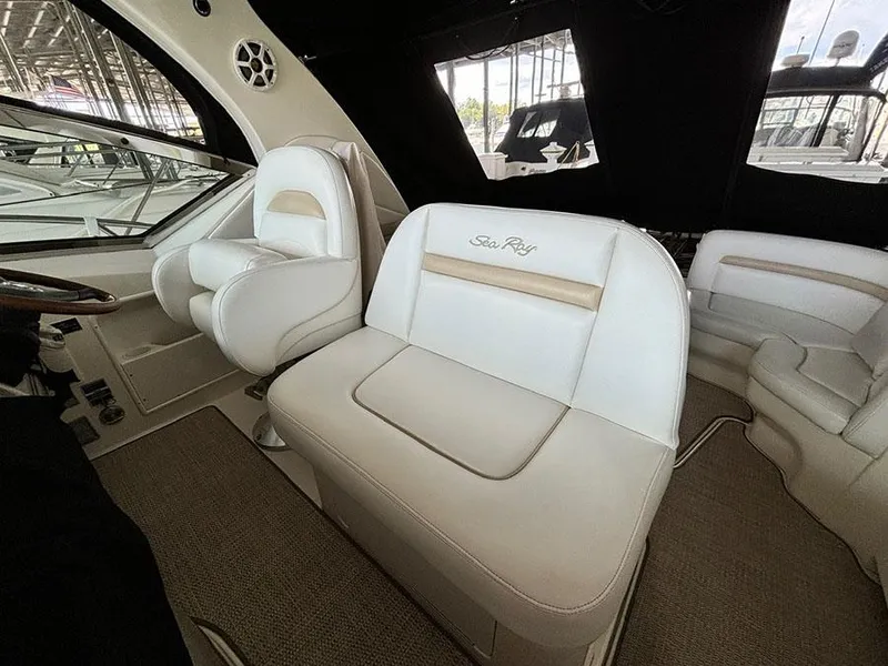 Slide: The Image of Interior of 2008 Sea Ray 38 Sundancer with white leather seating. - 12