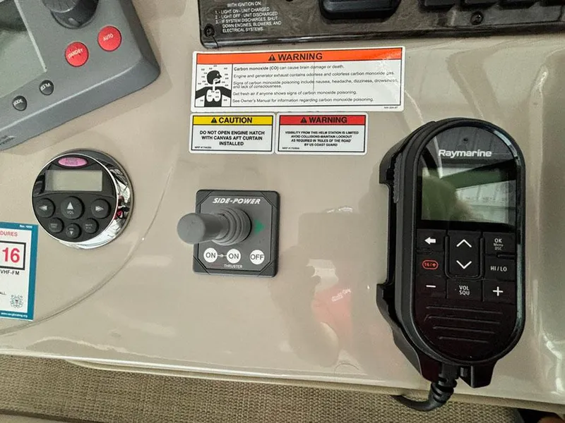 Slide: The Image of Control panel of a 2008 Sea Ray 38 Sundancer with Raymarine equipment and safety warnings. - 17