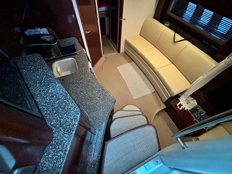 Slide: The Image of Interior of 2008 Sea Ray 38 Sundancer with kitchen and seating area. - 20