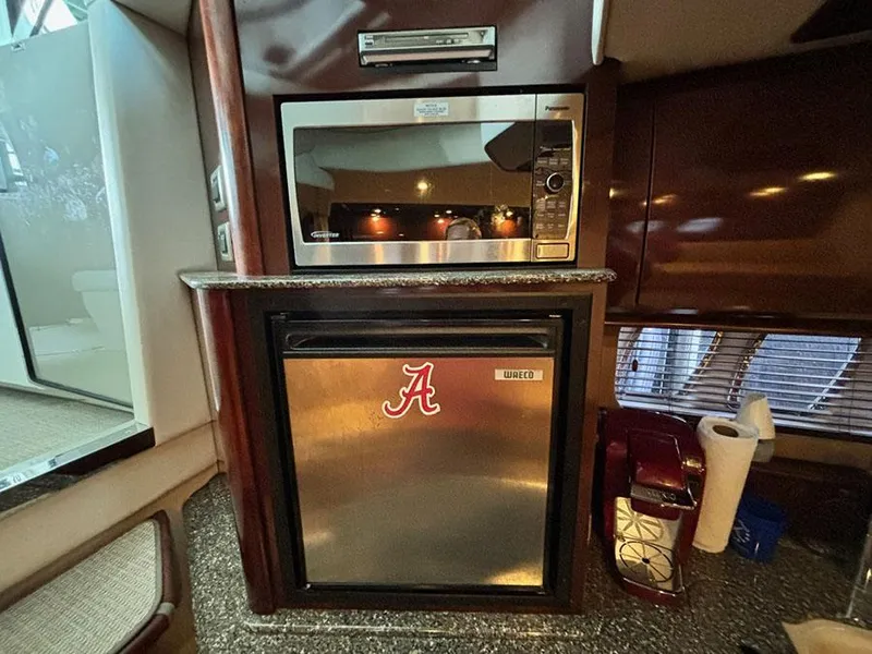 Slide: The Image of 2008 Sea Ray 38 Sundancer interior with microwave and mini fridge. - 22