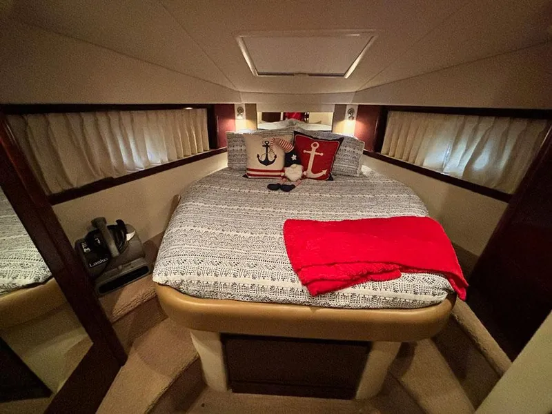 Slide: The Image of Luxurious 2008 Sea Ray 38 Sundancer cabin with cozy bedding and nautical decor. - 28