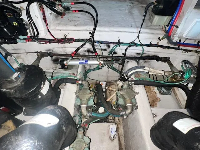 Slide: The Image of Engine compartment of a 2008 Sea Ray 38 Sundancer with visible wiring and components. - 31