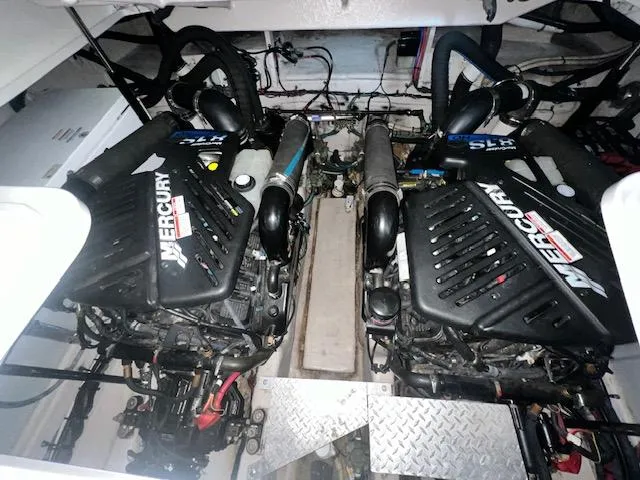 Slide: The Image of Engine room of 2008 Sea Ray 38 Sundancer with twin Mercury engines. - 32