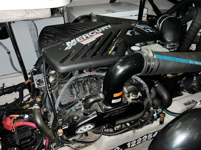 Slide: The Image of Engine of a 2008 Sea Ray 38 Sundancer with Mercury branding. - 33