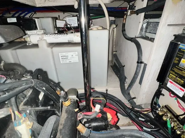 Slide: The Image of Engine compartment of a 2008 Sea Ray 38 Sundancer with visible wiring and components. - 35