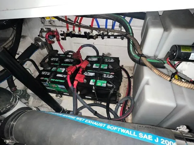 Slide: The Image of Battery compartment of a 2008 Sea Ray 38 Sundancer boat, showing wiring and connections. - 37