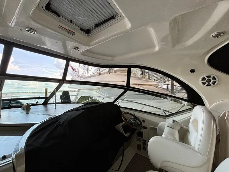 Slide: The Image of Interior view of 2008 Sea Ray 38 Sundancer yacht cockpit with helm and seating. - 5