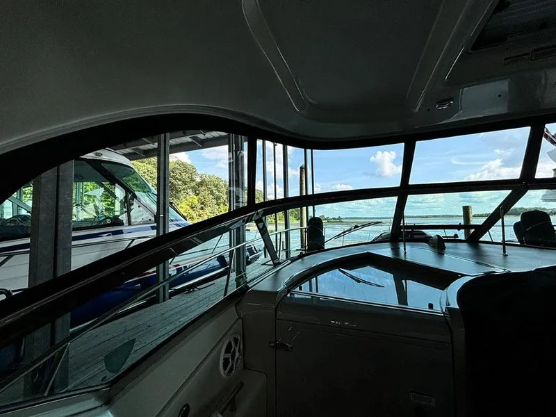 Slide: The Image of Interior view of 2008 Sea Ray 38 Sundancer yacht with scenic water backdrop. - 6