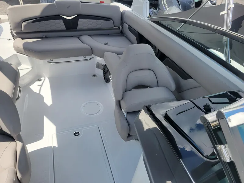 Slide: The Image of 2024 Four Winns HD5 OB boat interior with luxurious seating and modern design. - 13