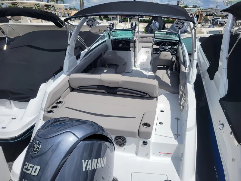Slide: The Image of 2024 Four Winns HD5 OB boat with Yamaha 250 outboard engine, spacious seating, and modern design. - 3