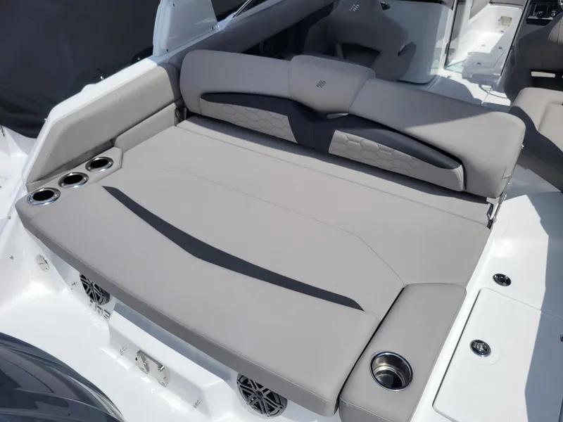 Slide: The Image of 2024 Four Winns HD5 OB boat with spacious, luxurious seating and cup holders. - 5