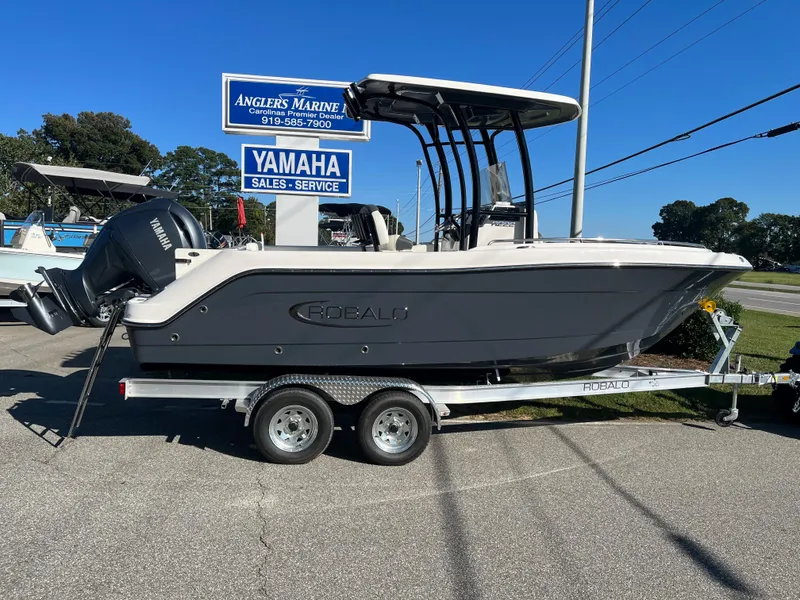 The Image of 2024 Robalo R222 Center Console boat on a trailer at Angler's Marine dealership. - 0