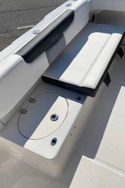Slide: The Image of 2024 Robalo R222 Center Console boat seating and storage area - 18