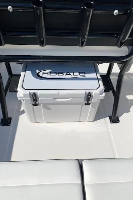 Slide: The Image of 2024 Robalo R222 Center Console boat with cooler storage. - 21