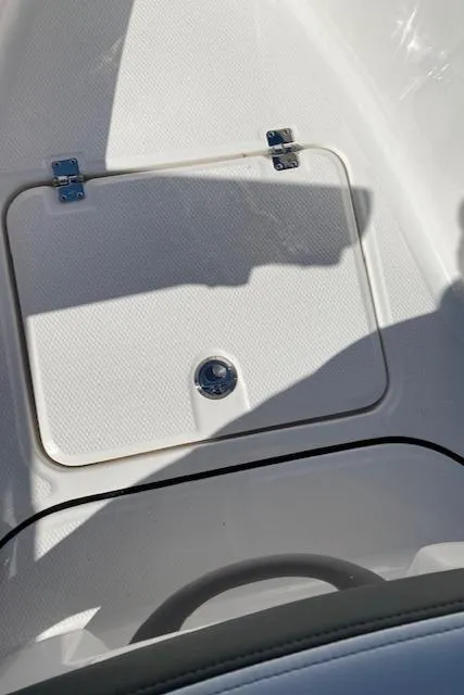 Slide: The Image of 2024 Robalo R222 Center Console storage compartment. - 11