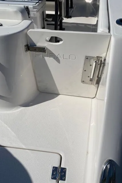 Slide: The Image of 2024 Robalo R222 Center Console boat interior with open hatch. - 24