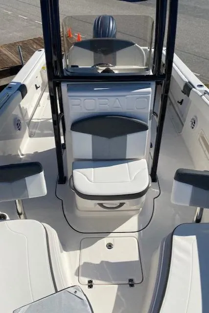 Slide: The Image of 2024 Robalo R222 Center Console boat interior with seating and console. - 4
