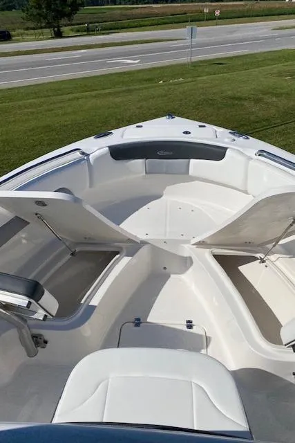 Slide: The Image of 2024 Robalo R222 Center Console boat with open storage compartments. - 8