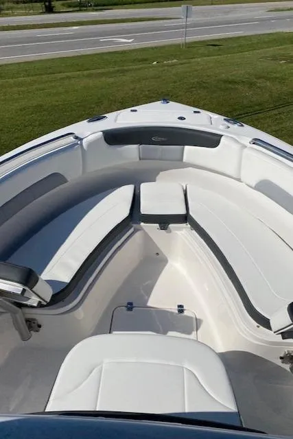 Slide: The Image of 2024 Robalo R222 Center Console boat with spacious seating area. - 1
