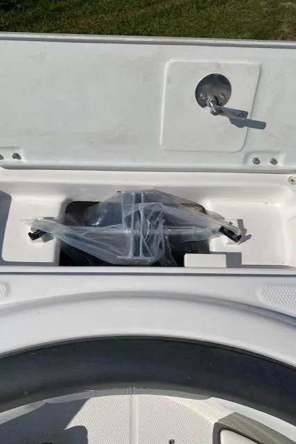 Slide: The Image of 2024 Robalo R222 Center Console storage compartment. - 6