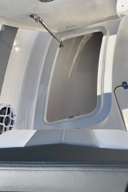 Slide: The Image of 2024 Robalo R222 Center Console storage compartment. - 9