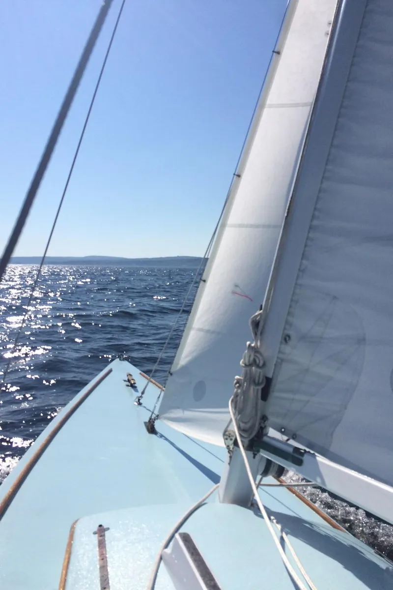 Slide: The Image of Sailing on a 1930 Classic Camden Haj Class boat under clear blue skies. - 3