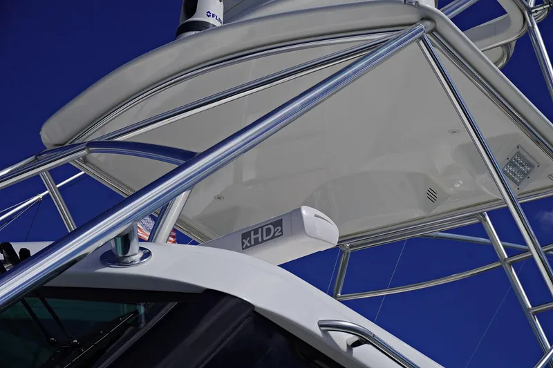 Slide: The Image of Henriques 42EXHT 2022 model boat with xHD2 radar against a clear blue sky. - 11