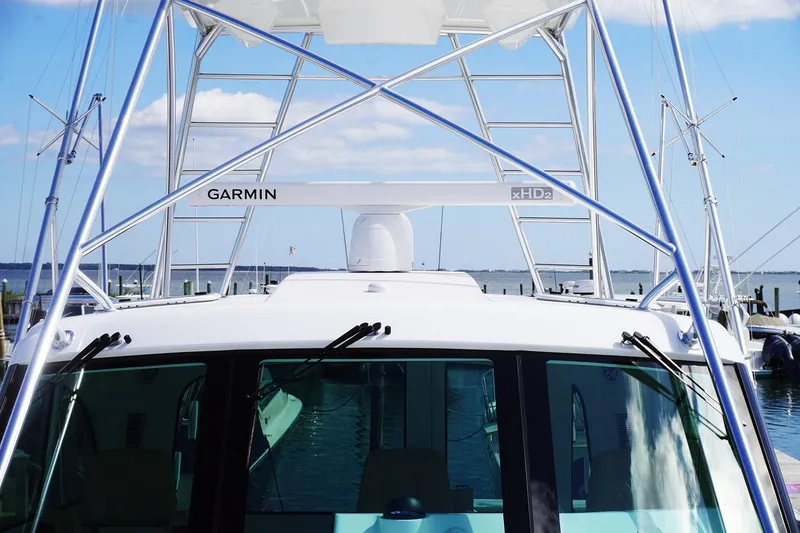 Slide: The Image of Henriques 42EXHT 2022 model boat with Garmin radar at the dock. - 14