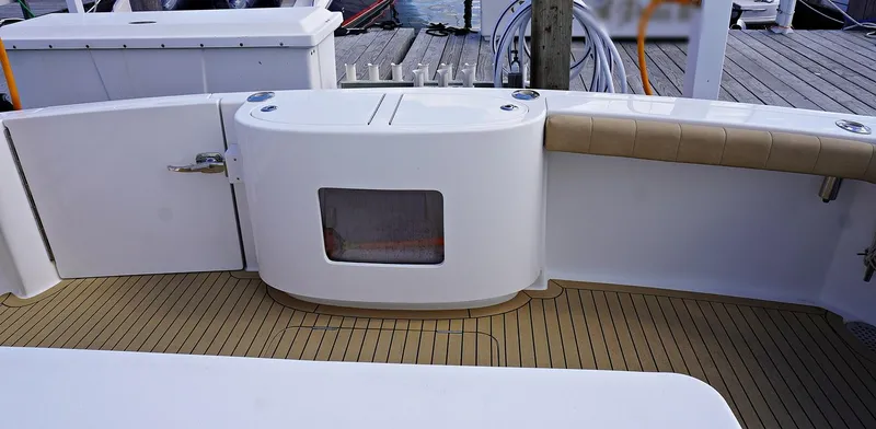 Slide: The Image of Henriques 42EXHT 2022 boat deck with storage and seating. - 16