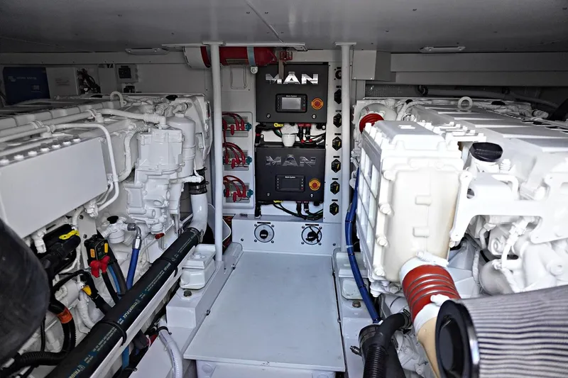 Slide: The Image of Engine room of a 2022 Henriques 42EXHT boat with MAN engines. - 28