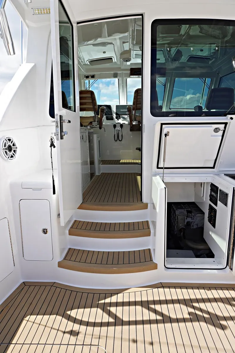 Slide: The Image of Henriques 42EXHT 2022 model boat interior with teak steps and modern cockpit. - 35
