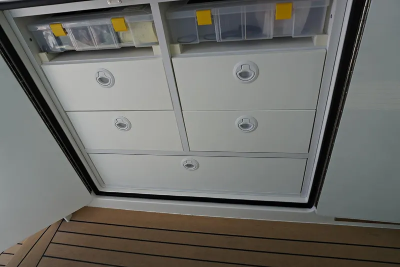 Slide: The Image of Storage drawers and compartments on a 2022 Henriques 42EXHT boat. - 40